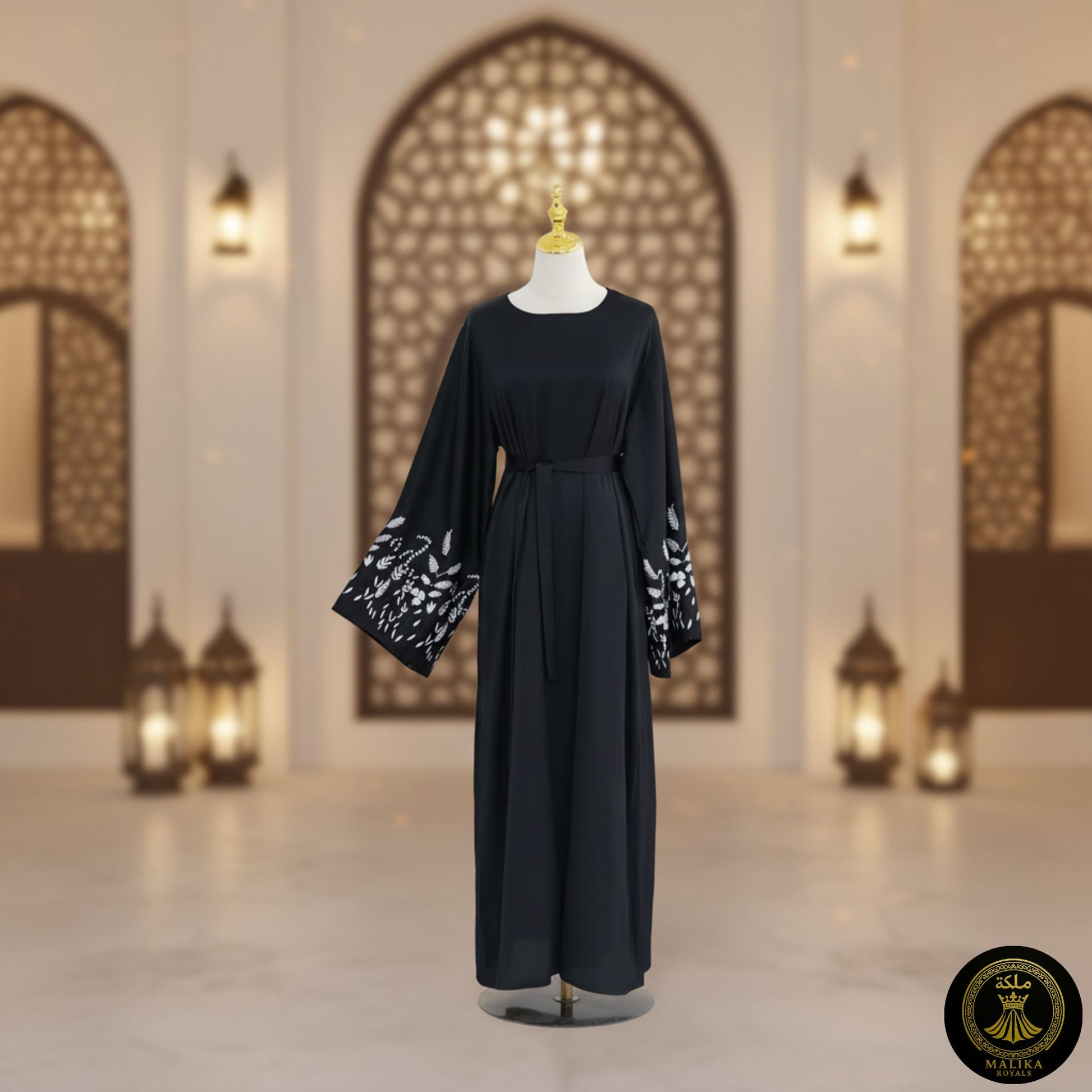 Black dress with white embroidery on a mannequin against an architectural background